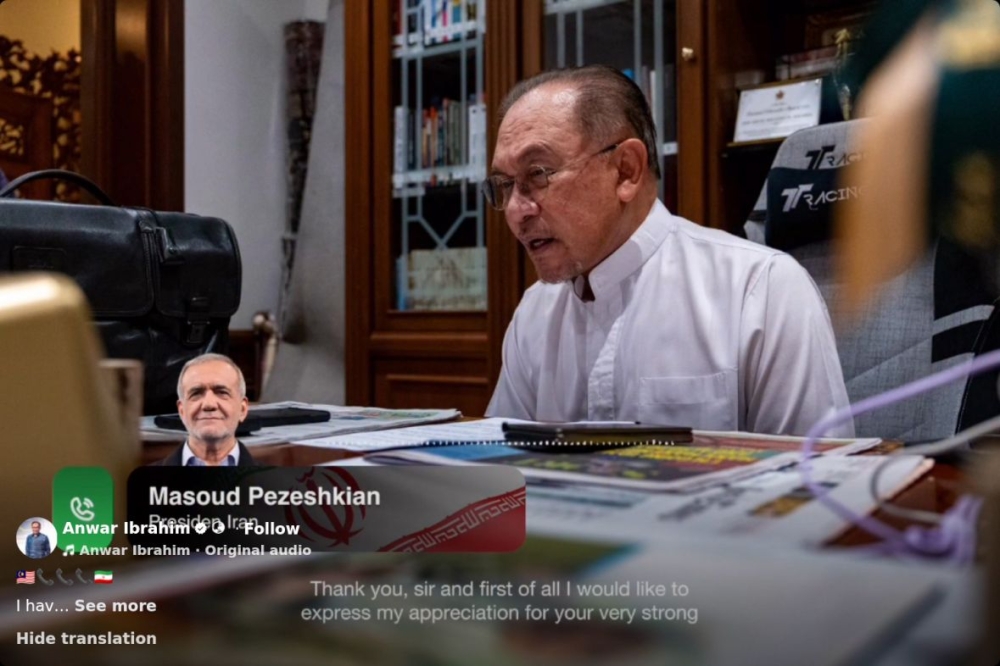 Datuk Seri Anwar Ibrahim is pictured in a telephonic conversation with Iranian President Masoud Pezeshkian. — PMO pic