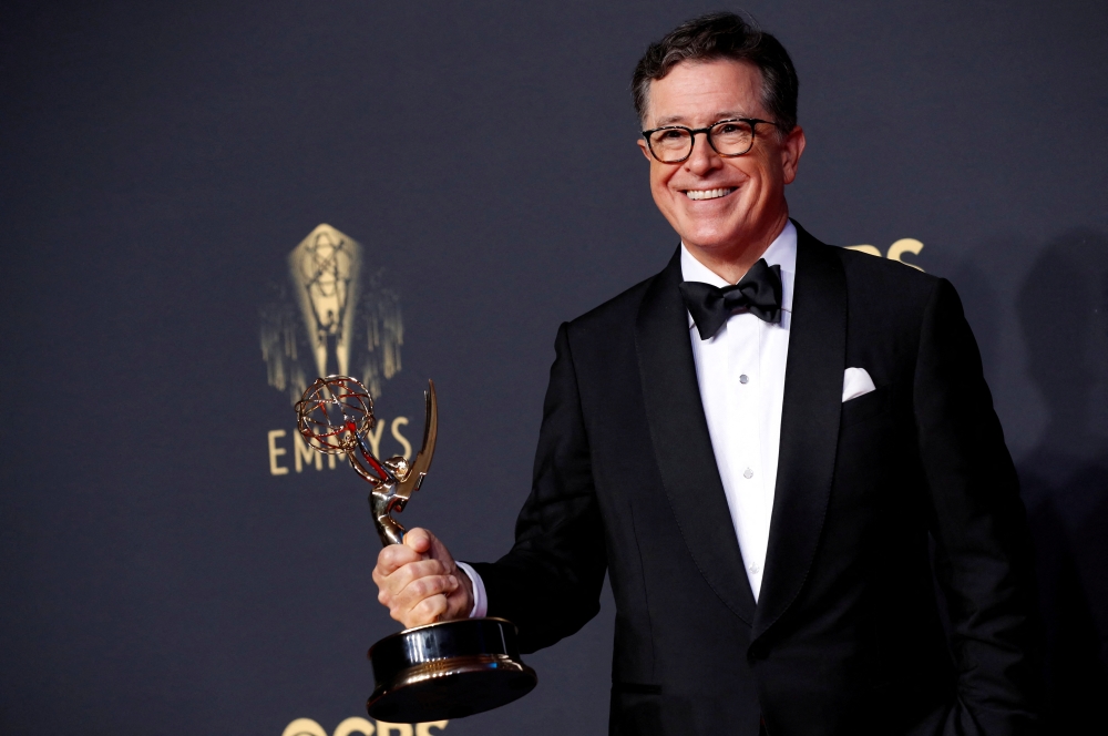 This file picture shows Stephen Colbert posing with his Emmy for Outstanding Variety Special (Live) at the 73rd Primetime Emmy Awards in Los Angeles September 19, 2021. — Reuters pic