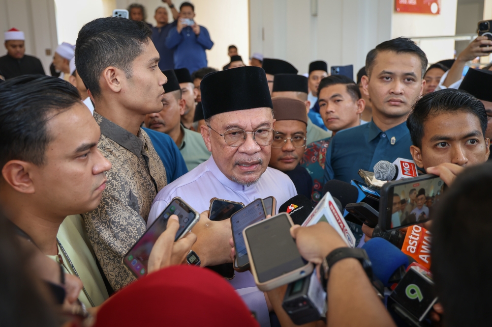 Prime Minister Datuk Seri Anwar Ibrahim speaks to reporters after performing Friday prayers at Masjid Tengku Ampuan Jemaah in Shah Alam on March 27, 2026. — Picture by Yusof Mat Isa