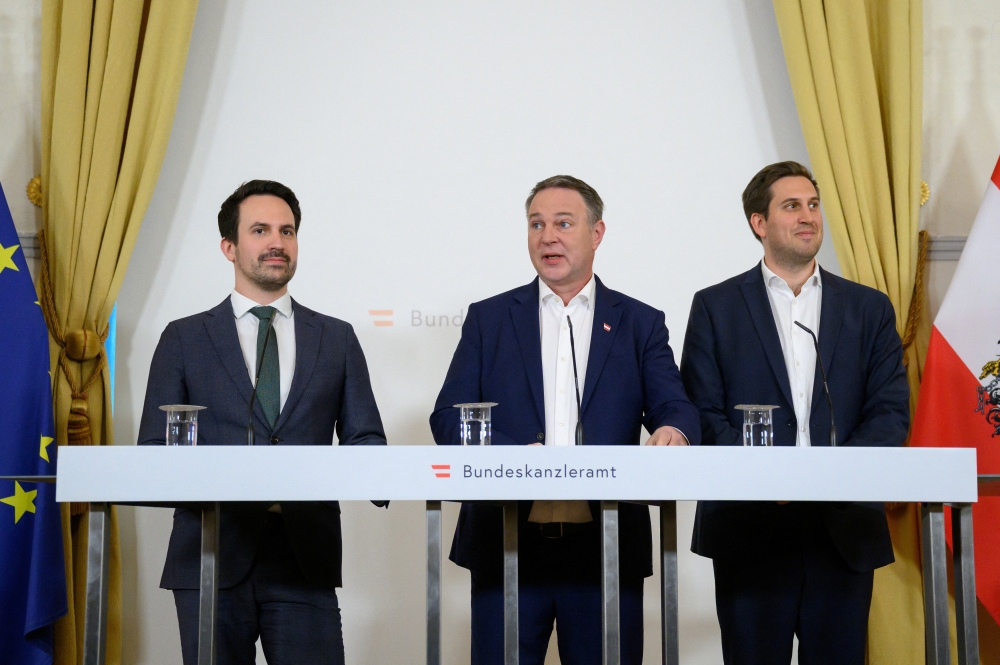 Vice Chancellor Andreas Babler of the Social Democrats, Secretary of State for Digitalization Alexander Proell of the People’s Party and Minister of Education Christoph Wiederkehr of the Neos hold a press conference on plans to ban social media for children under 14 years of age in Vienna March 27, 2026. — Reuters pic  