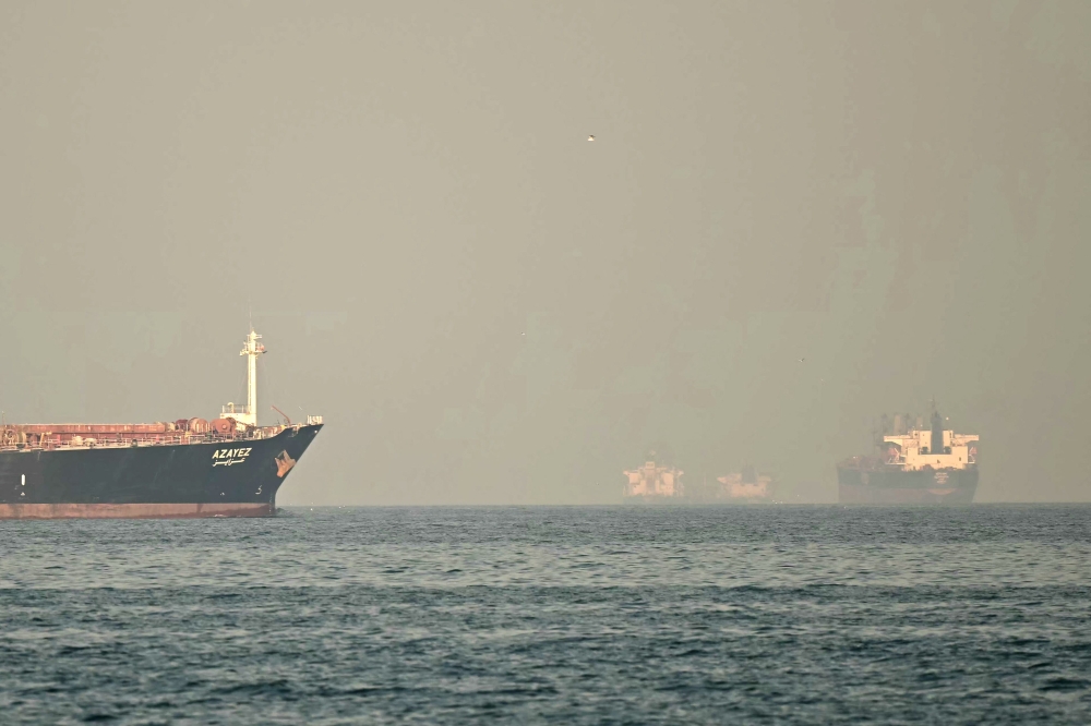 Cargo ships and tankers are seen off coast city of Fujairah, in the Strait of Hormuz in the northern Emirate on February 25, 2026. UN Secretary-General Antonio Guterres has launched an interagency task force to help secure the passage of fertilisers through the Strait of Hormuz, his spokesperson announced yesterday. — AFP pic 