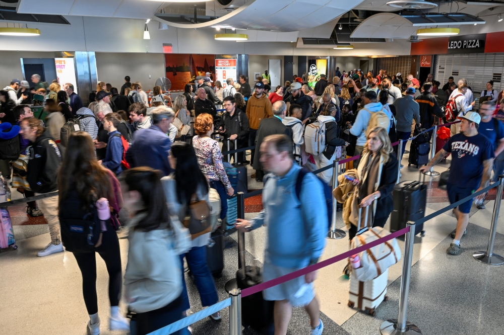 Passengers stand in line after the US Senate voted to end a partial government shutdown that has caused severe ‌delays at airports across the country, at Baltimore/Washington International Thurgood Marshall Airport (BWI), in Baltimore, Maryland March 27, 2026. — Reuters pic