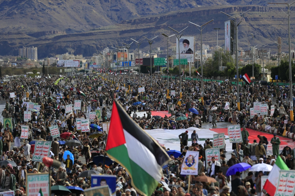 A Palestinian flag is raised as Houthis rally in solidarity with Iran and Lebanon. The Houthis in Yemen, a key part of Iran’s so-called ‘axis of resistance’, have joined the US-Israeli war on Iran by firing missiles at Israel on March 28, 2026. — AFP pic