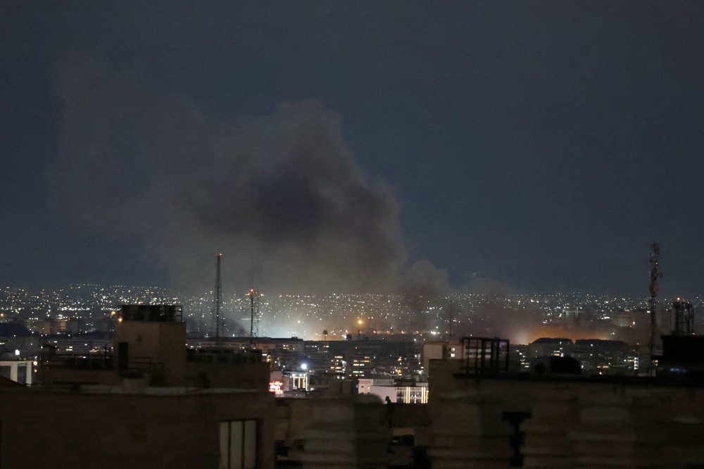 A plume of smoke rises from the site of a strike in Tehran early on March 28, 2026. Iran’s Revolutionary Guard is threatening retaliatory strikes US university campuses in the Gulf states after two Iranian universities were destroyed. —- AFP pic