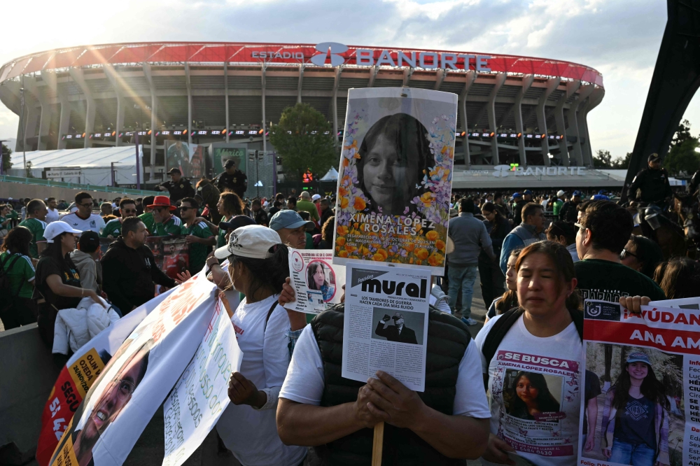 Demonstrators in Mexico City show signs of disappeared people ahead of the inauguration of Banorte Stadium (formerly known as Azteca), for a friendly match between Mexico and Portugal, in Mexico City on March 28, 2026. The demonstrators say Mexico’s World Cup preparation is overshadowing the capital’s pressing needs. — AFP pic