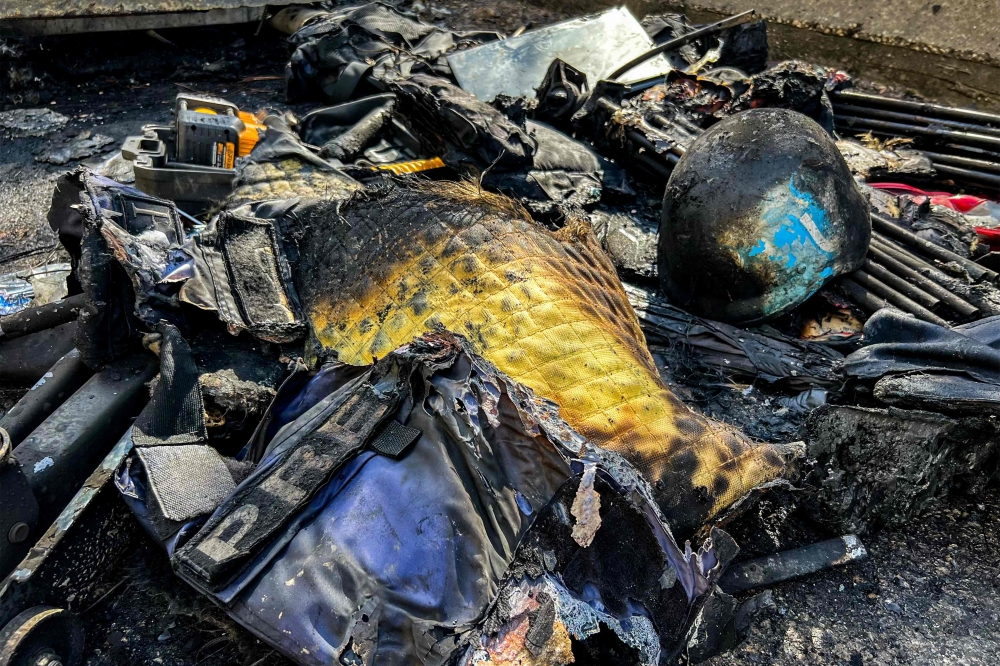 Gear that was used by a media crew of journalists who were killed in an Isareli strike earlier is displayed  near the husk of their destroyed vehicle along the side of a road leading to Jezzine in southern Lebanon on March 28, 2026. — AFP pic