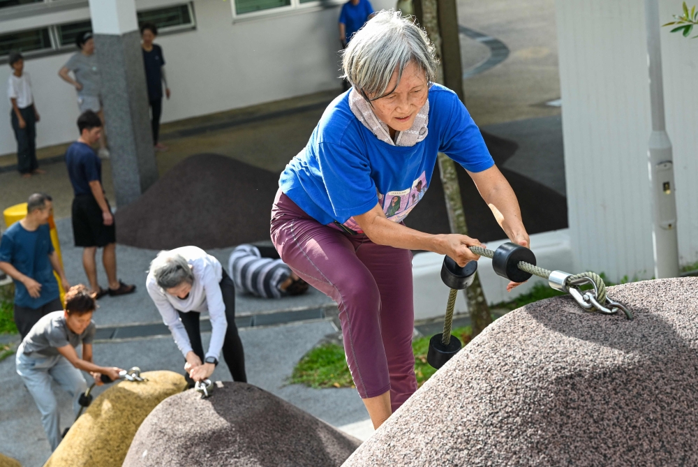 This photograph taken on March 17, 2026 shows Singaporean elders taking part in a parkour training session in Singapore. This is ‘geriatric parkour’, where around 20 retirees learned to tackle a series of relatively demanding exercises, building their agility and enjoying a sense of camaraderie. — AFP pic 