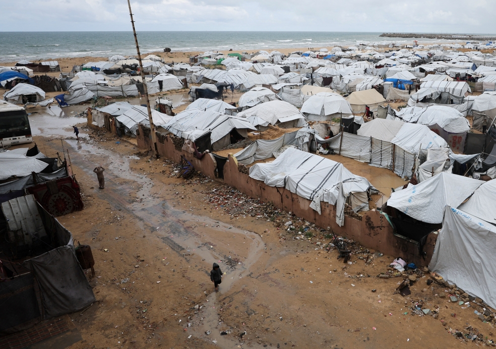 Displaced Palestinians shelter in a tent camp on a rainy day in Gaza City, March 26, 2026. Egypt has given a clear guarantee and commitment to facilitate the distribution of 374 tonnes of humanitarian aid from Malaysia to the Palestinian population in Gaza through the Rafah border crossing starting this April, said Datuk Seri Anwar Ibrahim. — Reuters pic  