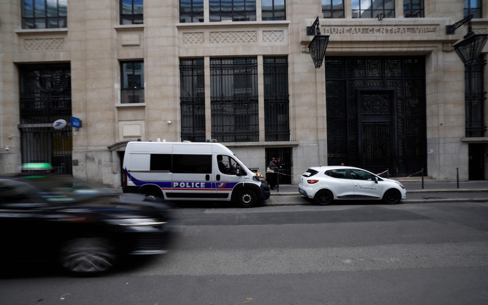 Police and private security vehicles stand outside The Bank of America building in the 8th arrondissement of Paris on March 28, 2026, following an apparent bomb attack attempt. French police stopped an apparent bomb attack outside a US bank in Paris early yesterday, when they arrested a man about to set off a homemade explosive device, sources close to the case told AFP. — AFP pic 