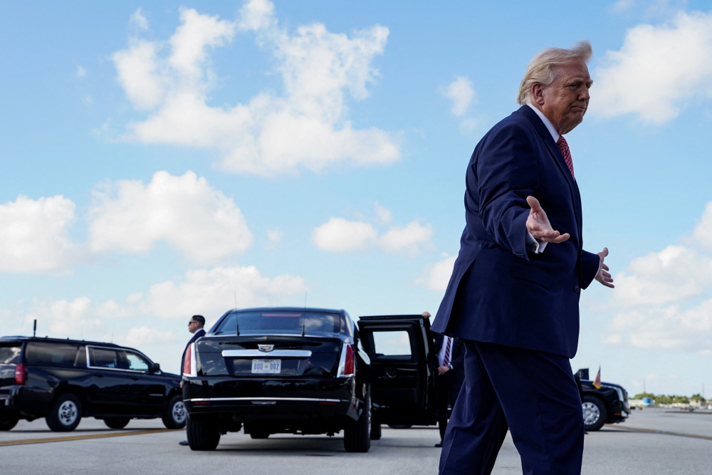 US President Donald Trump reacts to a shouted question about Iran as he arrives at Miami International Airport in Miami, Florida March 27, 2026. — Reuters pic