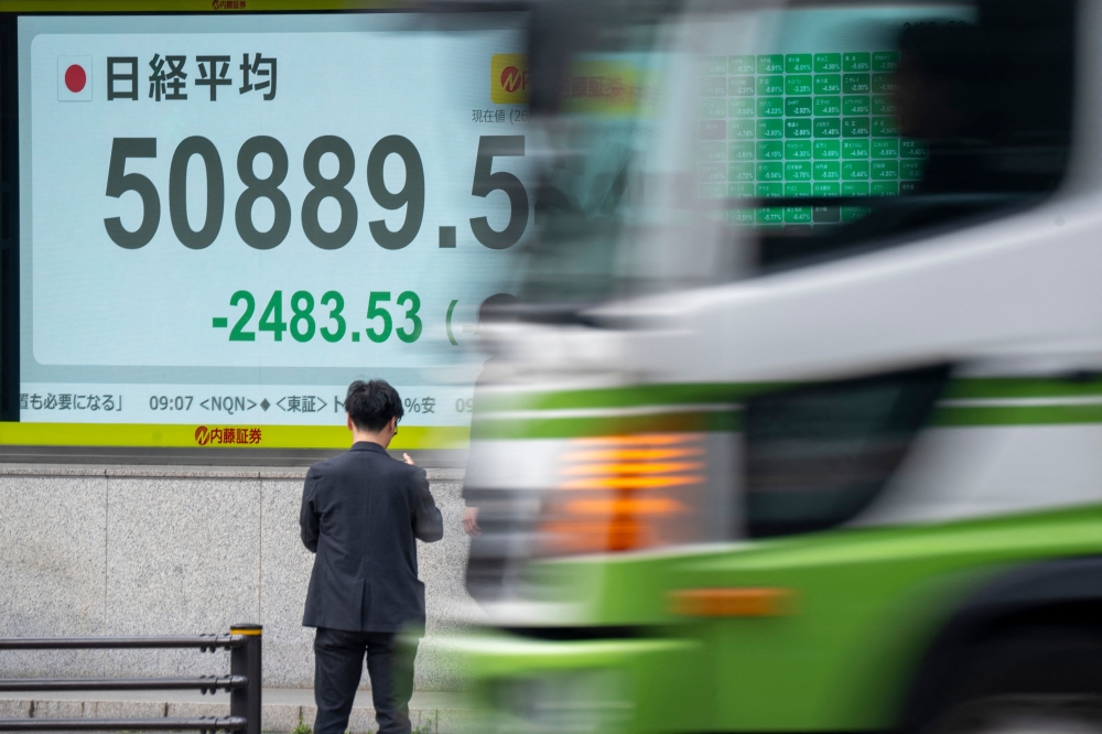 An electronic quotation board displays the Nikkei Stock Average on the Tokyo Stock Exchange along a street in Tokyo on March 30, 2026. — AFP pic 