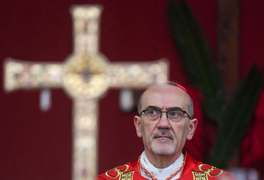 Latin Patriarch of Jerusalem, Cardinal Pierbattista Pizzaballa, leads a prayer service to mark Palm Sunday in Jerusalem on March 29, 2026, following the cancellation of the traditional Palm Sunday procession from the Mount of Olives amid restrictions on gathering in large groups and the US-Israeli war on Iran. — Ammar Awad/Pool/AFP pic