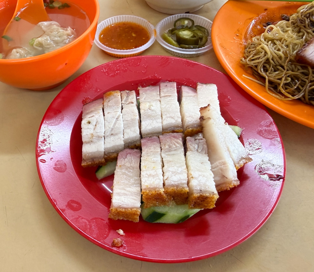 Roast pork has a fluffy crackling with a thicker layer of fat matched with tender meat. — Picture by Lee Khang Yi