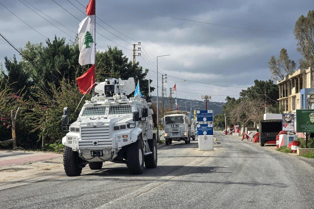 United Nations peacekeepers with the UN Interim Force in Lebanon (Unifil) drive past a Lebanese army outpost in the area of Naqura in southern Lebanon on March 27, 2026. Indonesia today confirmed that one of its peacekeepers was killed and three others injured after indirect artillery fire hit a Unifil position in southern Lebanon. — AFP pic 
