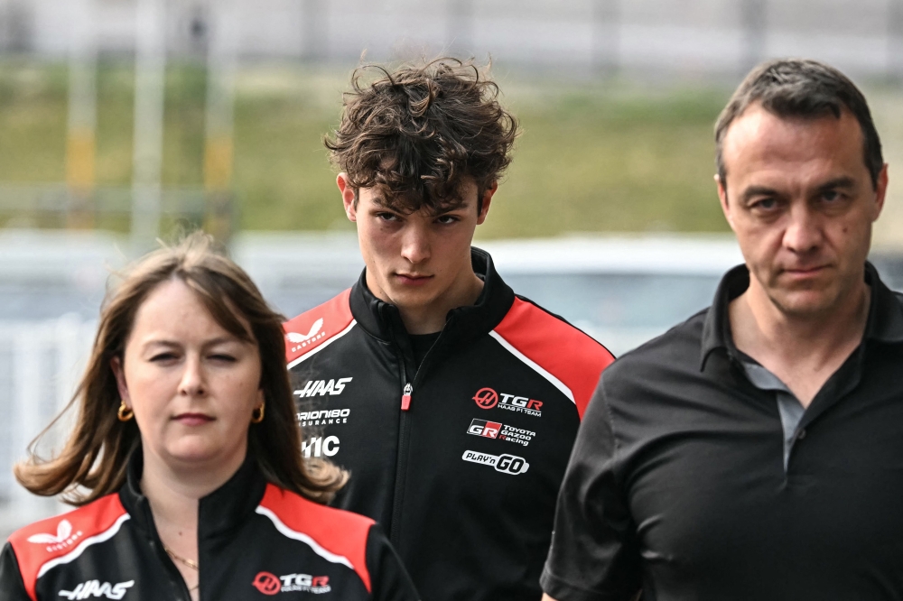 Haas F1 Team's British driver Oliver Bearman (centre) walks back to the paddock after crashing in the Formula One Japanese Grand Prix at the Suzuka circuit in Suzuka, Mie prefecture on March 29, 2026. — AFP pic