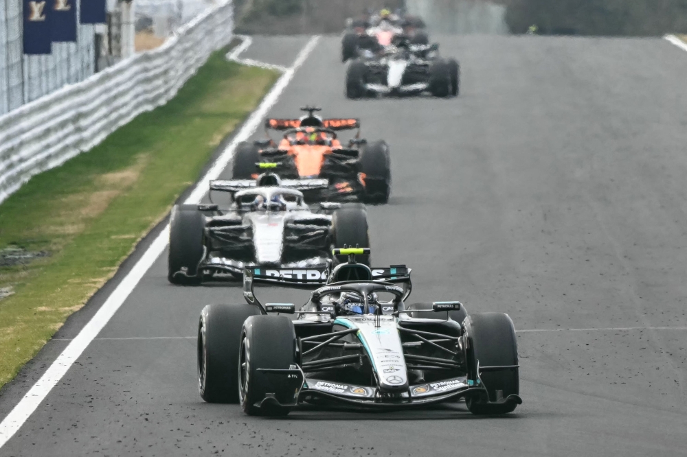  Drivers follow the safety car after a crash by Haas F1 Team's British driver Oliver Bearman during the Formula One Japanese Grand Prix at the Suzuka circuit in Suzuka, Mie prefecture on March 29, 2026. — AFP pic