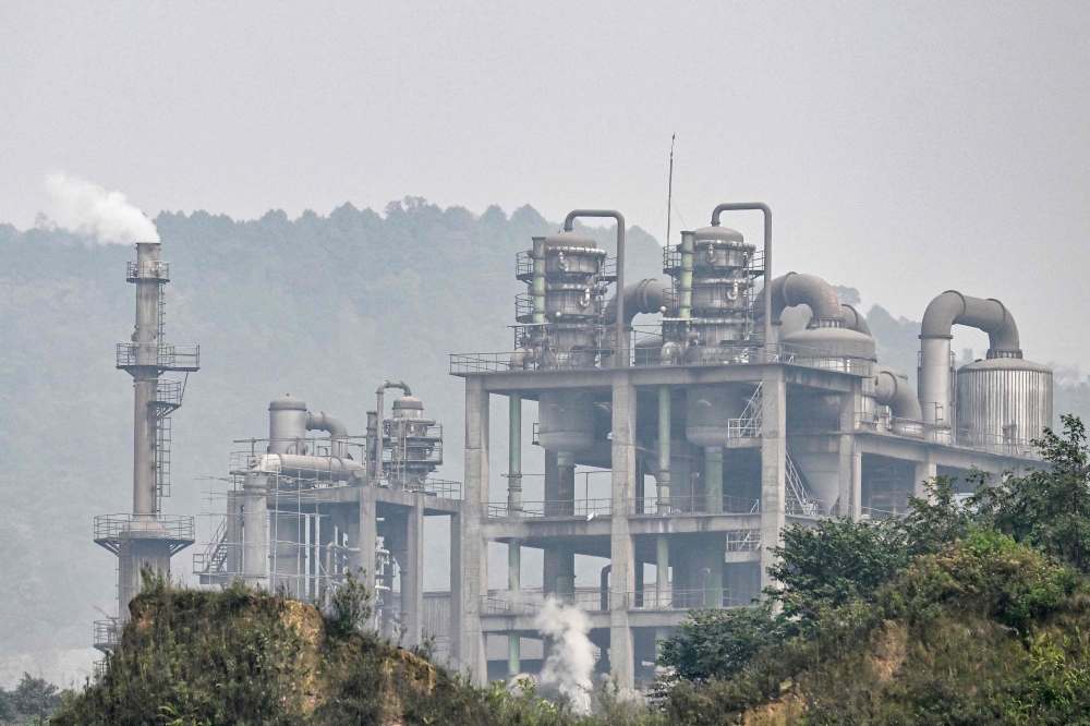 This photo taken on March 19, 2026, shows Smoke and dust from the Duc Giang Lao Cai chemical plant in the Tang Loong industrial Park, Lao Cai Province, northern Vietnam. Grey and white smoke around the clock, dust-covered trees and nonstop noise: residents living next to Vietnam's biggest chemical production complex coexist with toxic fumes from the factories. — AFP pic