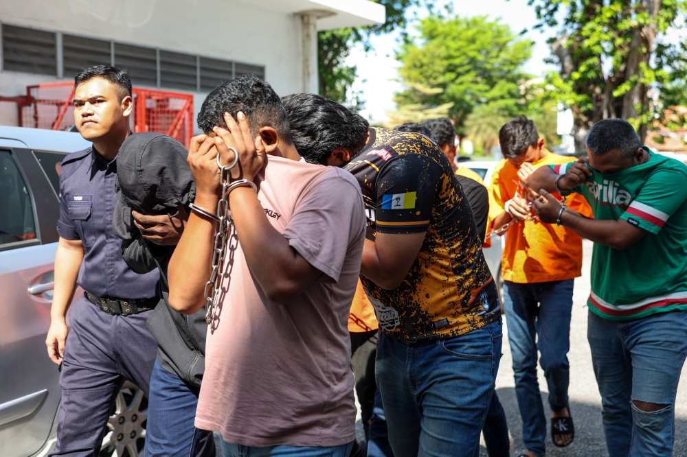 Eight men pleaded not guilty at the Magistrate’s Court to a charge of intentionally causing injury to three policemen. — Bernama pic