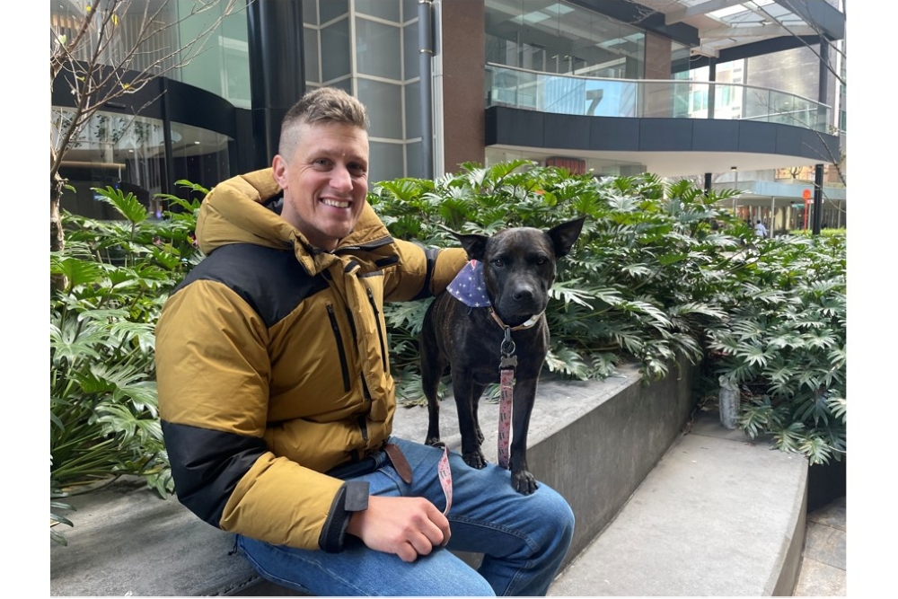Paul Conyngham with his dog Rosie, whose cancer entered partial remission after receiving an AI-assisted experimental treatment. — Picture via X/Paul S. Conyngham