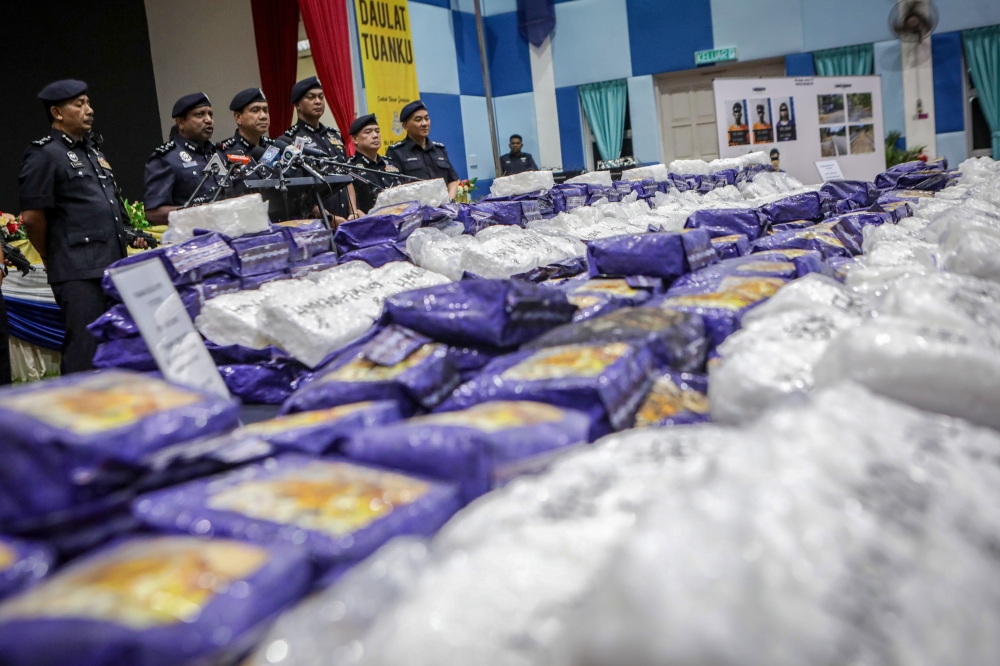 Police arrested five individuals, including a married couple, and seized 510 kilogrammes (kg) of methamphetamine worth an estimated RM25.5 million in three separate raids. — Bernama pic