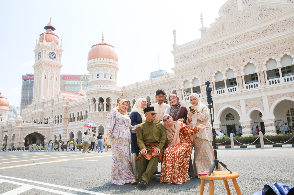 On the first day of Hari Raya Aidilfitri, tourists are seen at the Sultan Abdul Samad Building in Kuala Lumpur March 21, 2026. — Picture by Choo Choy MayE