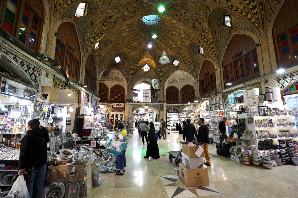 People shop at the Grand Bazaar in Tehran on March 30, 2026. — AFP pic