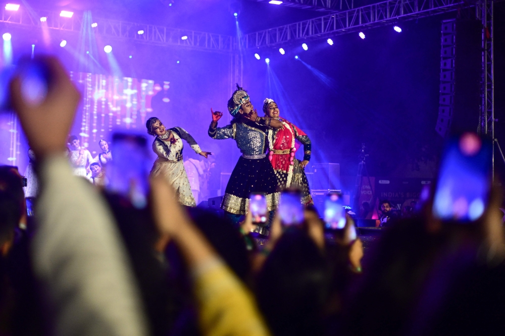 Artists dance to Hindu spiritual songs called 'Bhajans' during the Sanatan Journey devotional music festival at the iconic Purana Qila in New Delhi on March 1, 2026. — AFP pic
