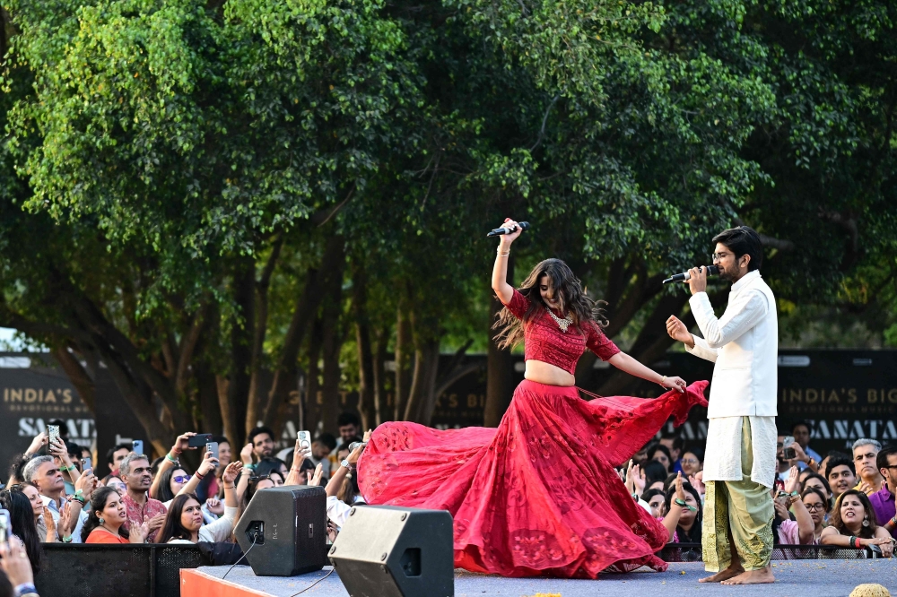 Artists Agam Aggarwal (R) and Aarti Khetarpal perform to Hindu spiritual songs called 'Bhajans' during the Sanatan Journey devotional music festival at the iconic Purana Qila in New Delhi on March 1, 2026. — AFP pic