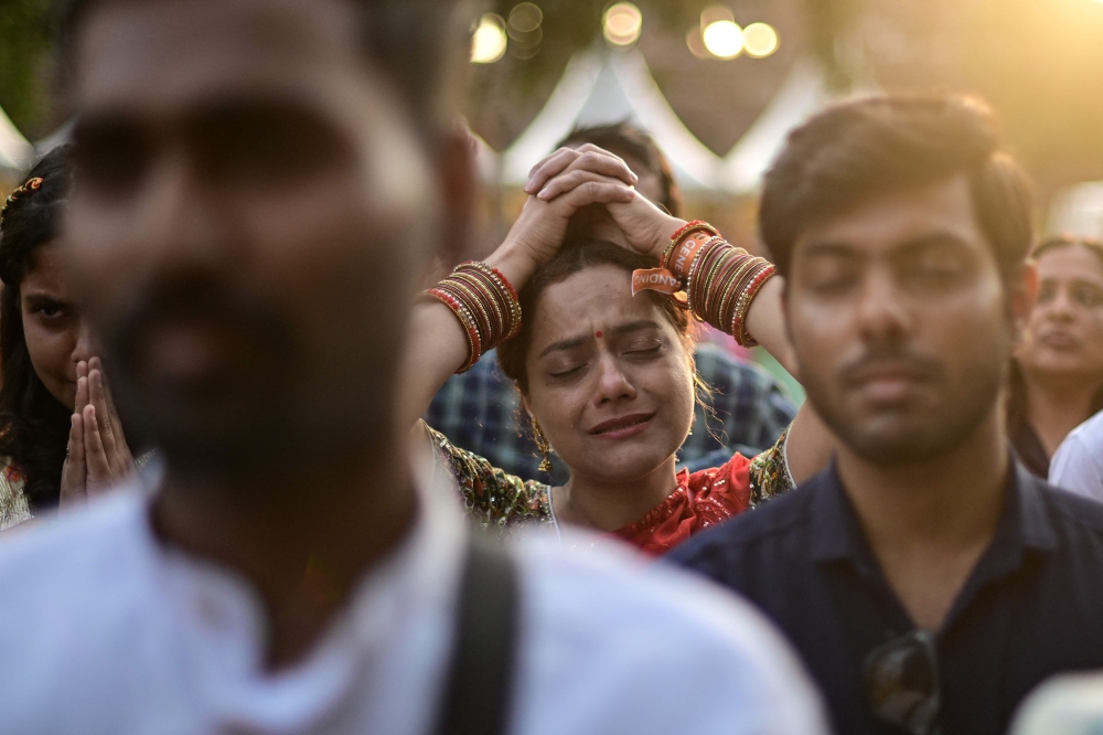 A reveller immersed in Hindu spiritual songs called 'Bhajans' takes part in the Sanatan Journey devotional music festival at the iconic Purana Qila in New Delhi on March 1, 2026. — AFP pic