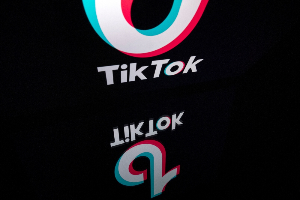X and TikTok have been issued letters of caution by the Singapore Infocomm Media Development Authority for serious weaknesses in detecting and removing child sexual exploitation and abuse material and terrorism content. — AFP pic