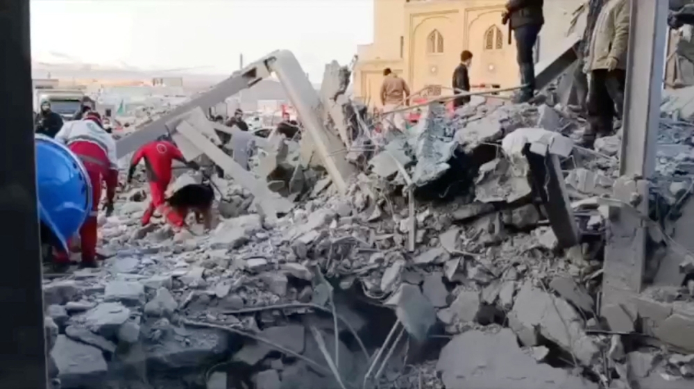 Members of the Iranian Red Crescent Society work at the site of a reported strike amid the US-Israeli conflict with Iran, near a Mosque in Zanjan, Iran, in this screen grab taken from a handout video released on March 31, 2026. — Iranian Red Crescent Society handout via Reuters