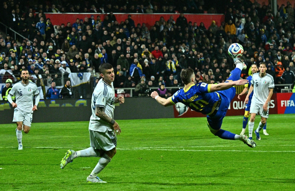 Bosnia-Herzegovina’s forward #10 Ermedin Demirovic (R) kicks the ball in front of Italy’s defender #23 Gianluca Mancini during the FIFA World Cup 2026 European qualification final football match between Bosnia-Herzegovina and Italy at the Bilino-Polje stadium in Zenica on March 31, 2026. — AFP