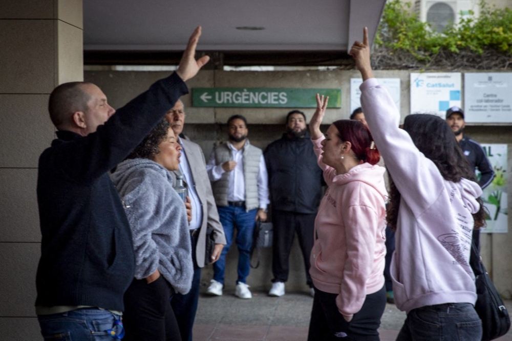 Religious groups gather outside the medical centre in Sant Pere de Ribes, Barcelona, on March 26, 2026, following 25-year-old Noelia Castillo’s legal euthanasia, amid a heated national debate in Spain on the right to die. — AFP pic
