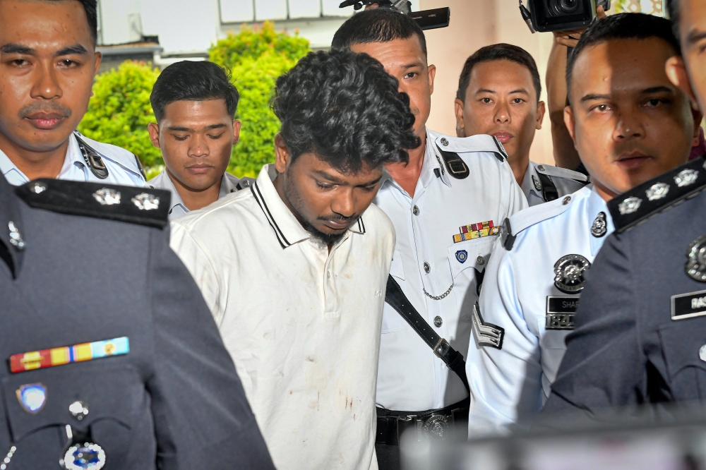 The driver at the centre of a viral crash that hurled a motorcyclist onto another car was brought before the Magistrates’ Court here today to face a murder charge and a separate drug offence. — Bernama pic