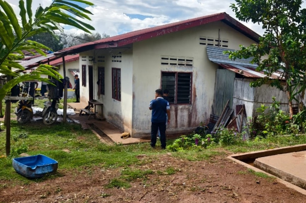 Police investigating the scene at Kampung Kangkawang in Tenom. — Picture courtesy of police