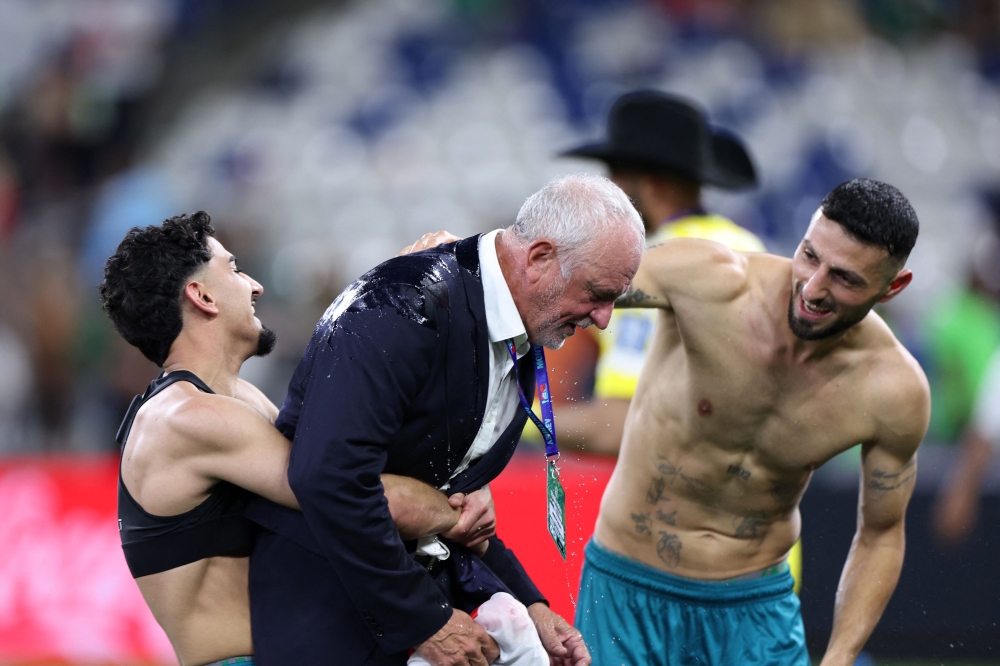 Iraq’s Australian coach Graham Arnold celebrates with his players after winning the 2026 Fifa World Cup qualifiers final playoff football match between Iraq and Bolivia at the BBVA Stadium in Guadalupe, Nuevo Leon state, Mexico, on March 31, 2026. — AFP pic