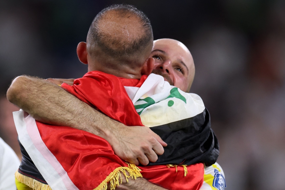 Iraq’s goalkeeper #22 Ahmed Basil (R) hugs a teammate after winning the 2026 Fifa World Cup qualifiers final playoff football match between Iraq and Bolivia at the BBVA Stadium in Guadalupe, Nuevo Leon state, Mexico, on March 31, 2026. — AFP pic