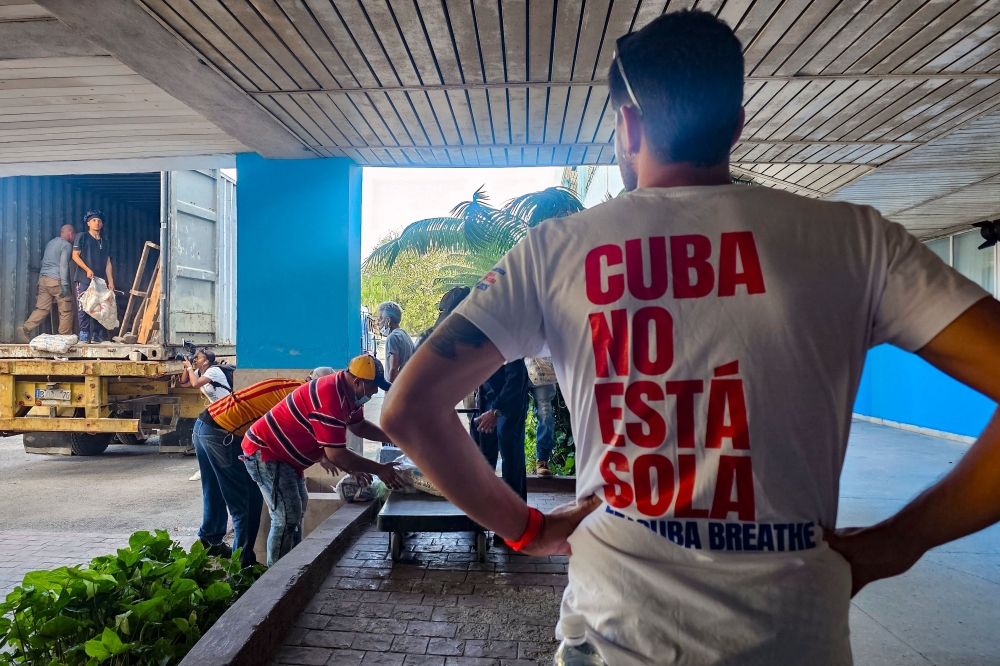 Aid brought by the Nuestra America flotilla from Mexico is unloaded at the William Soler Pediatric Cardiocenter in Havana on March 25, 2026. — AFP pic
