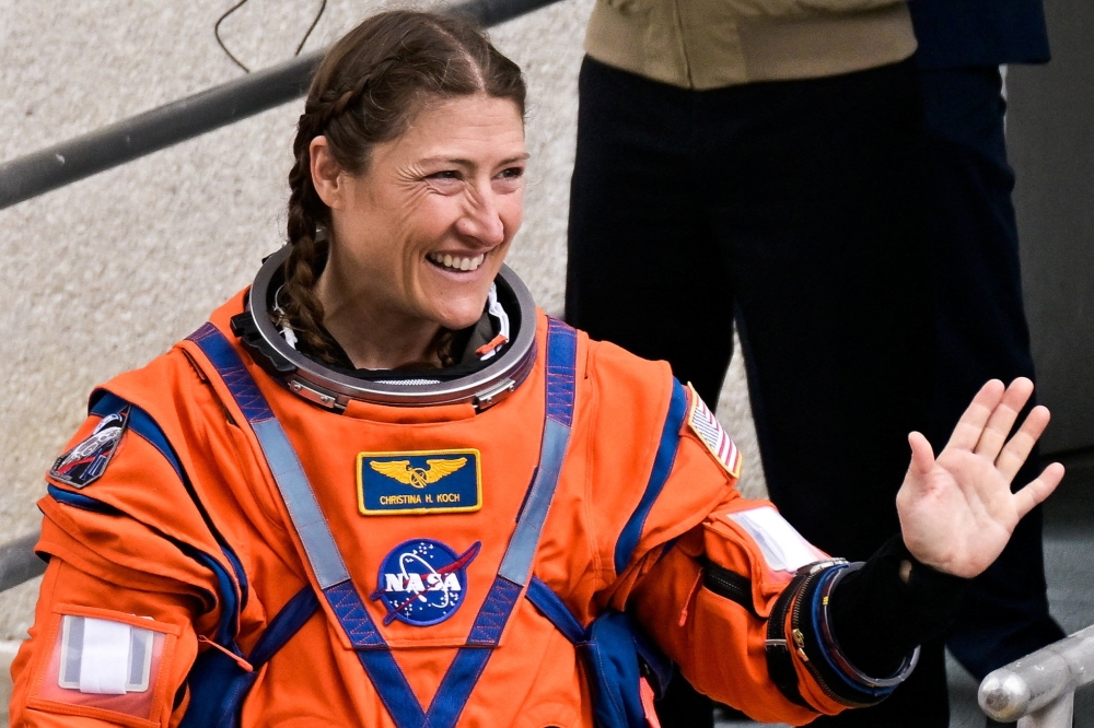 Nasa astronaut Christina Koch waves before boarding the astronaut van with Artemis II crew members at the Kennedy Space Center in Cape Canaveral, Florida, April 1, 2026. — Reuters pic