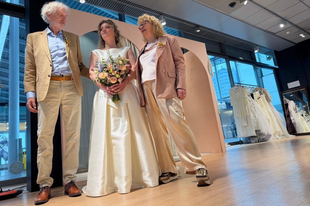 Sustainable development communications specialist and bride-to-be Lara Beters stands in a ‘Free Fashion’ pop-up shop shortly before her wedding inside Utrecht train station as part of an initiative to highlight sustainability issues, in Utrecht on April 2, 2026. — AFP pic 