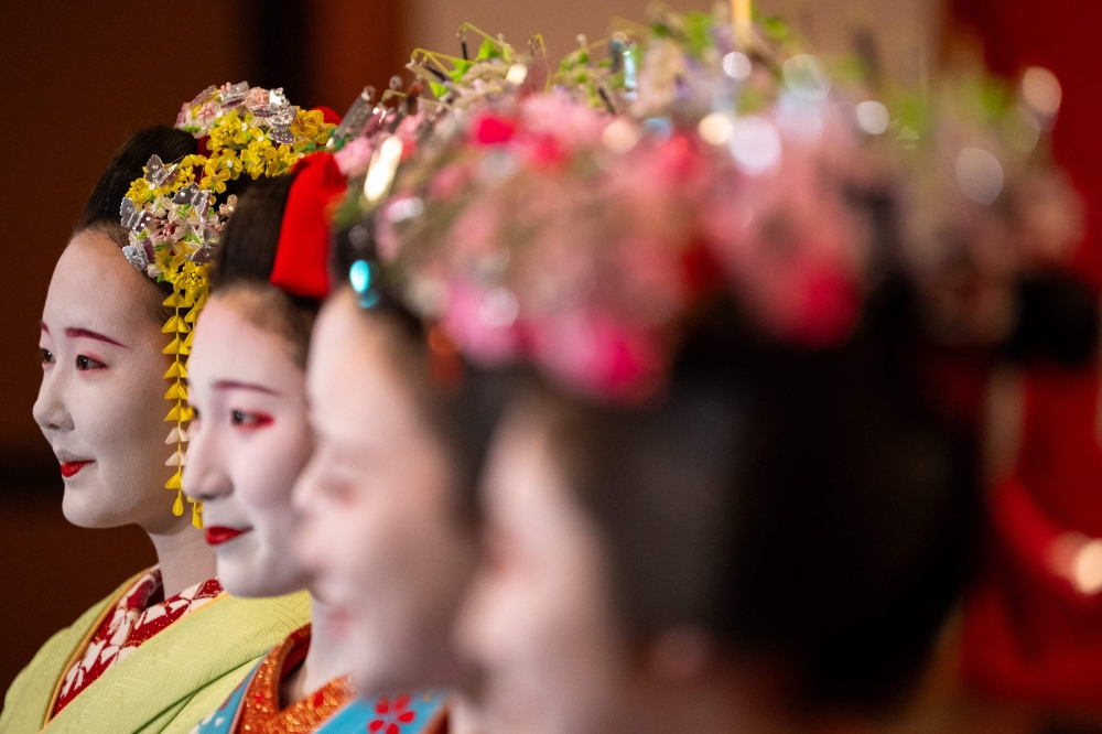Maiko (apprentice geisha) take part in a press interview ahead a rehearsal for the annual ‘Miyako Odori’ in Kyoto on March 31, 2026. — AFP pic