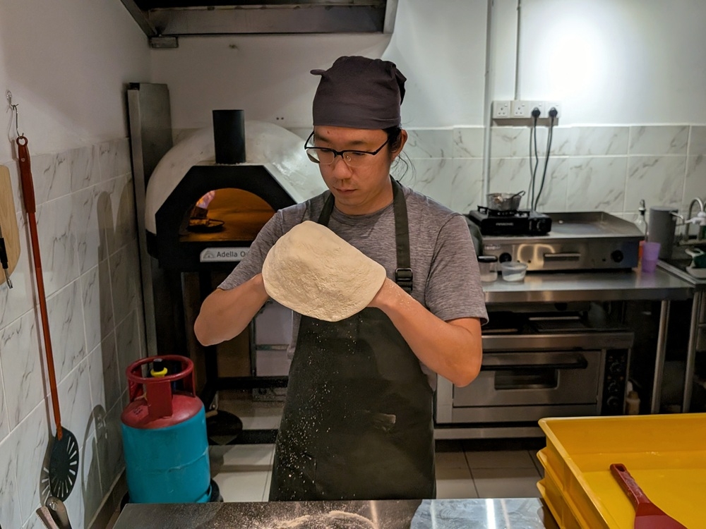 Friendly owner Shane Law is the lifeblood of the place, making the dough, tossing the pizza and coming up with all the creative flavours. — Picture by Ethan Lau