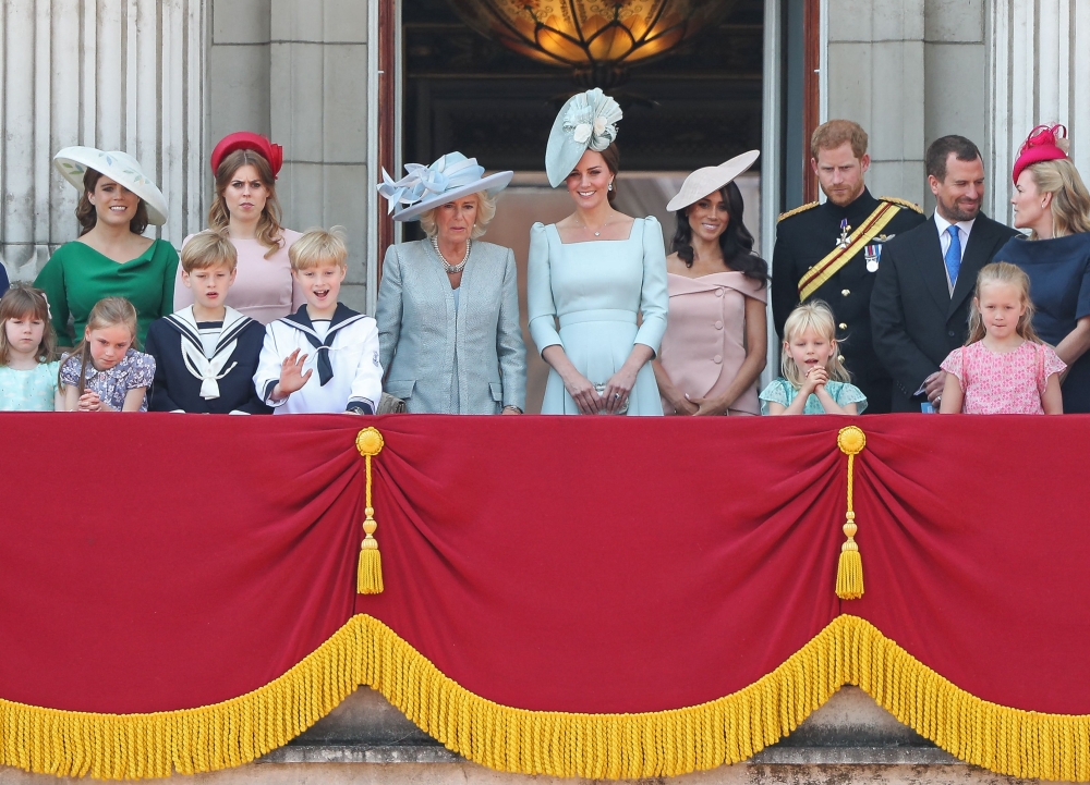 (From left) Members of the Royal Family Britain's Princess Eugenie of York, Britain's Princess Beatrice of York, Britain's Camilla, Duchess of Cornwall, Britain's Catherine, Duchess of Cambridge, Britain's Meghan, Duchess of Sussex, Britain's Prince Harry, Duke of Sussex, Peter Phillips, Autumn Phillips, Isla Phillips and Savannah Phillips, stand on the balcony of Buckingham Palace to watch a fly-past of aircraft by the Royal Air Force, in London on June 9, 2018. — AFP pic 