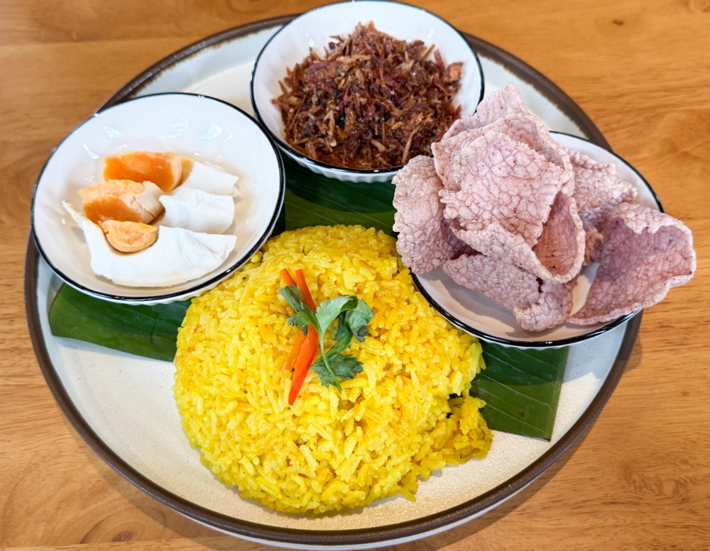 The Rice Set can be ordered with a choice of turmeric rice or jasmine rice paired with three side dishes, like ‘telur masin’, crispy fried ‘ikan bilis’ and ‘keropok dabai’. — Picture by Lee Khang Yi