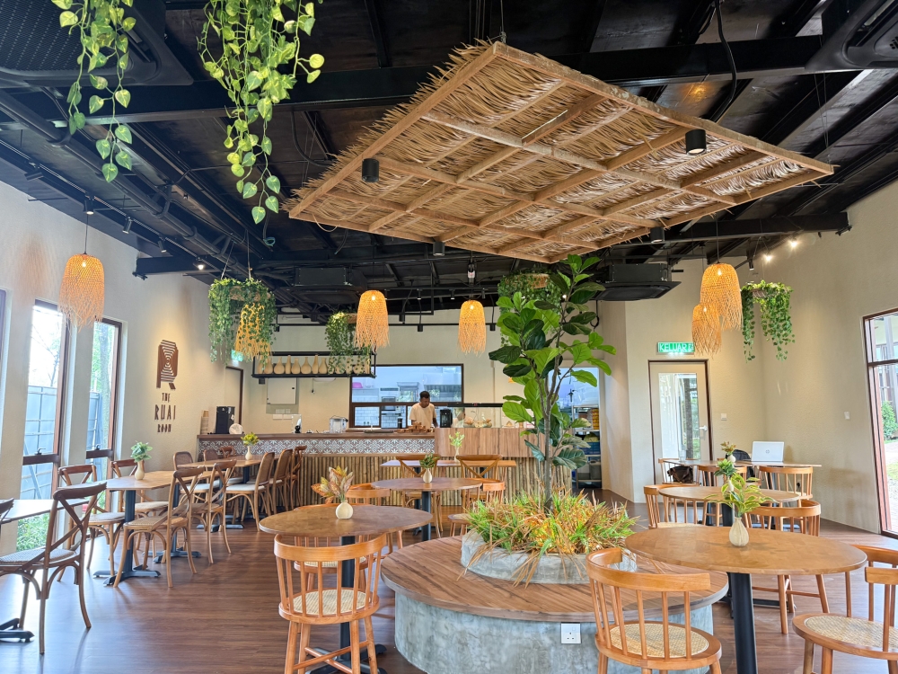 Relax in a rustic designed dining space where the main feature is a thatched roof similar to those found in a Borneo longhouse. — Picture by Lee Khang Yi