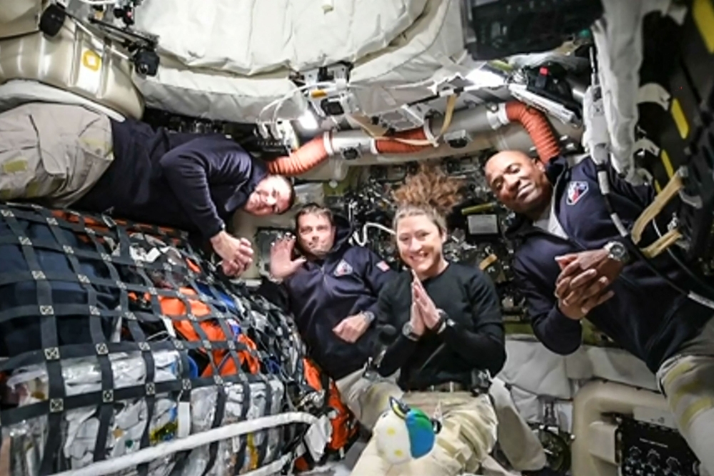 Artemis II crew members Canadian Space Agency astronaut Jeremy Hansen, NASA astronauts Reid Wiseman, Christina Koch and Victor Glover are seen in a screen grab from a NASA feed as they head to orbit the Moon on April 3, 2026. — AFP pic