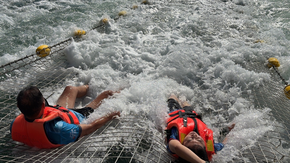 Visitors enjoy a sea jacuzzi experience during a boat ride to Forest Island. — Picture by Opalyn Mok