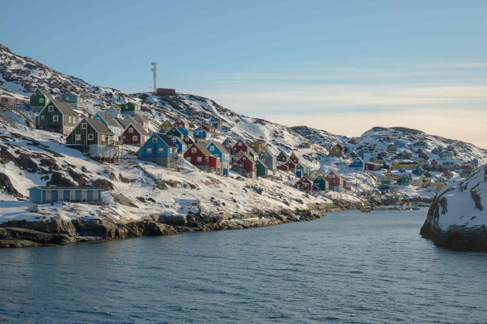 This photograph taken from the deck of the ferry Sarfaq Ittuk, shows, in the morning light, the village of Kangaamiut, Greenland, on March 14, 2026. — AFP pic 