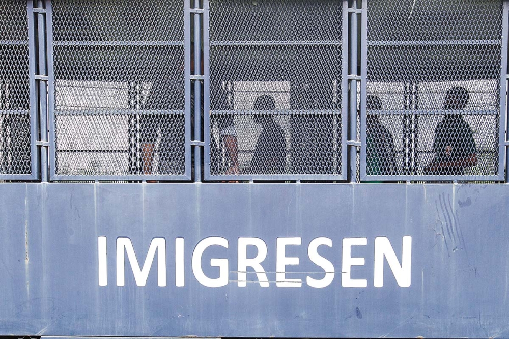 Rooftop chases, midnight raid: Immigration nabs 69 in Jalan Imbi crackdown, most working as GROs