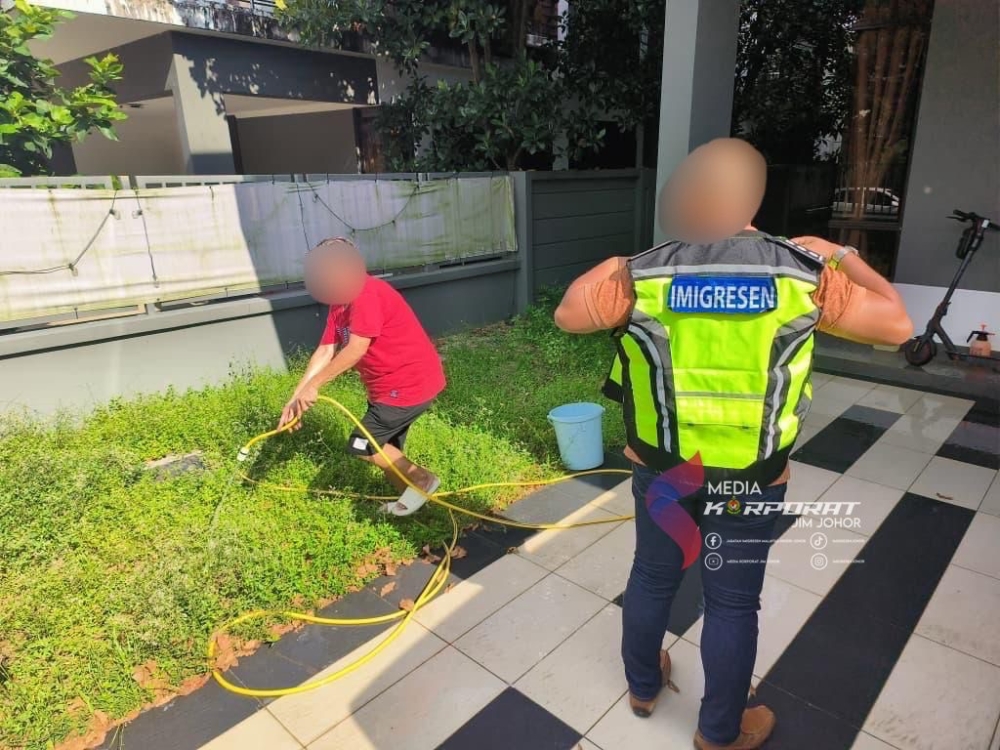 This Filipina who works as a cleaner at the Horizon Hills, Johor Bahru house of a wanted South Korean fraud suspect was also found to have overstayed for over one year, during the raid by Johor Immigration on April 8, 2026. — Picture courtesy of the Johor Immigration Department